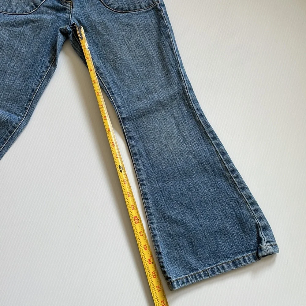 Gymboree flared jeans with gem buttons.  Girls size 7